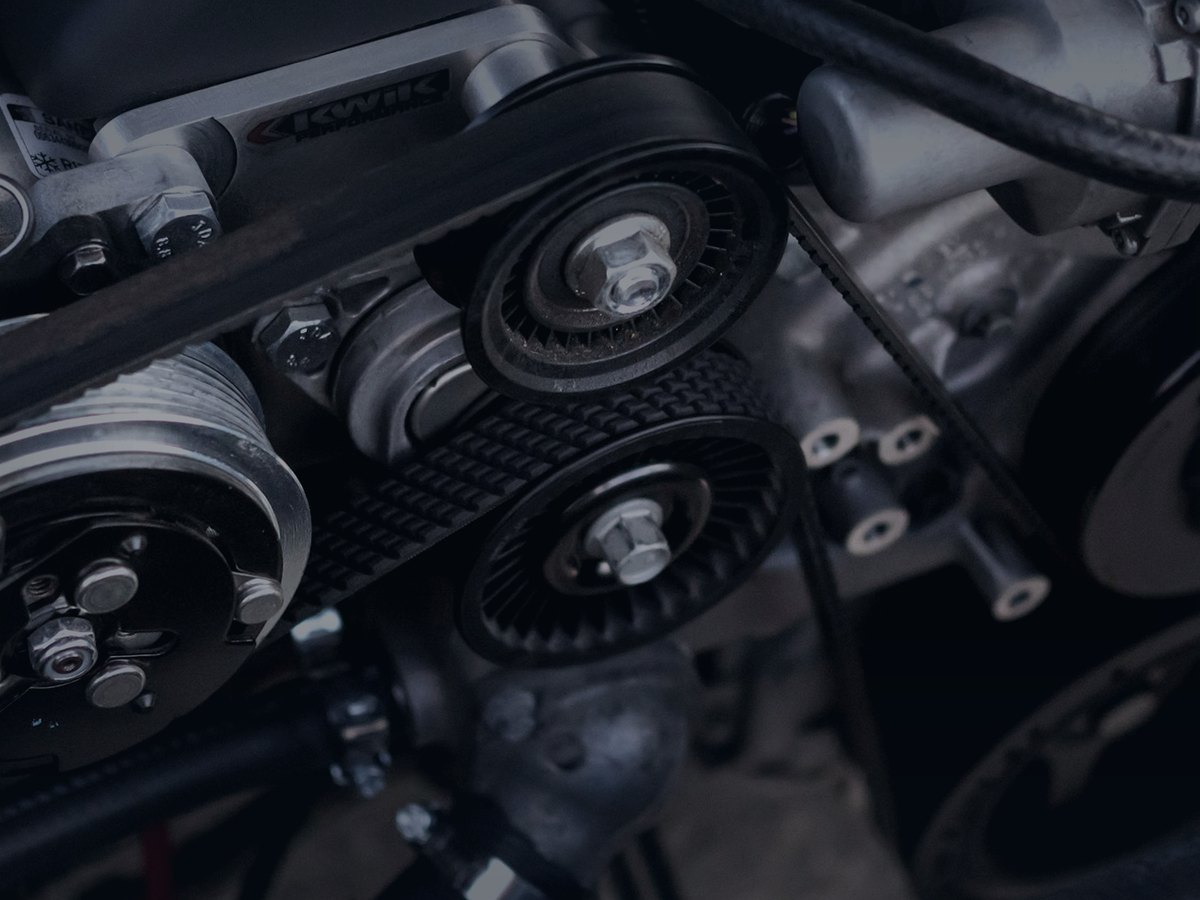 Close-up of engine belts, pulleys and ancillary drive
